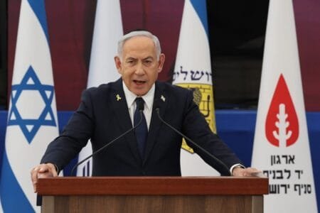 Macron publicly feuded with Netanyahu last year after calling for a halt to arms deliveries to Israel. | Pool photo by Abir Sultan/EPA-EFE
