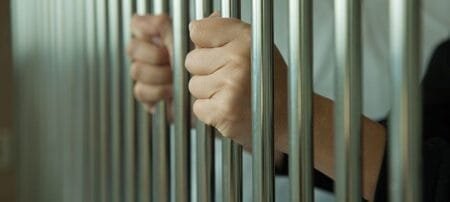 inmate hands on bars8567067592988356548jpg