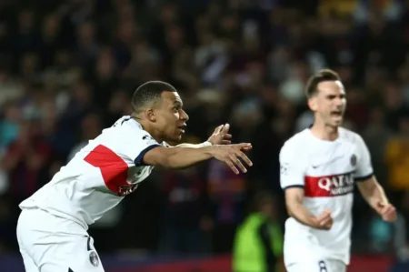 Paris Saint-Germain striker Kylian Mbappe celebrates converting his penalty against Barcelona in the Champions League. Photo: FRANCK FIFE / AFP Source: AFP