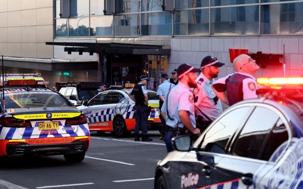 A police officer reacts outside the Westfield Bondi Junction shopping mall after a stabbing incident in Sydney on 13 April 2024. Photo: AFP / David Gray