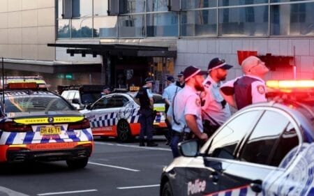 A police officer reacts outside the Westfield Bondi Junction shopping mall after a stabbing incident in Sydney on 13 April 2024. Photo: AFP / David Gray