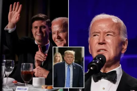“Smiling Joe” Biden is flanked by White House Correspondents’ Dinner comic host Colin Jost and NBC White House senior correspondent Kelly O’Donnell at Saturday’s event.REUTERS