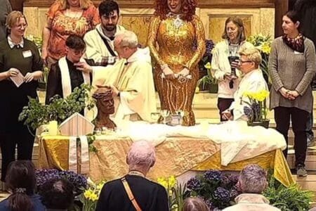 Episcopal Diocese of Massachusetts Bishop Alan M. Gates takes the clerical collar from Rev. Tamara Tucker during a easter vigil last month in Boston.The Catholic Church St. Paul