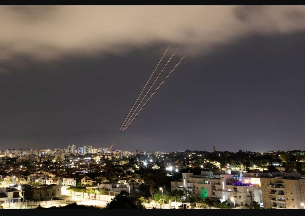 An antimissile system targets an Iranian aerial attack on Israel early Sunday. (Amir Cohen/Reuters)