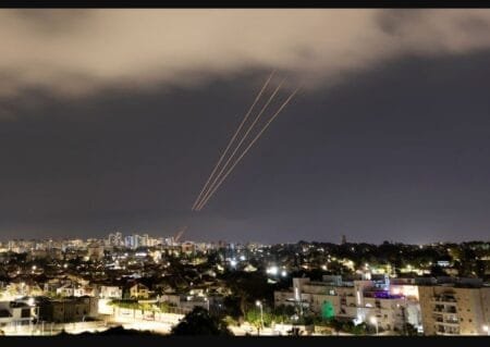 An antimissile system targets an Iranian aerial attack on Israel early Sunday. (Amir Cohen/Reuters)