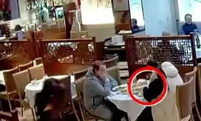 CCTV footage captures the woman planting hair in her food (Picture: Oriental Garden Restaurant Northampton)