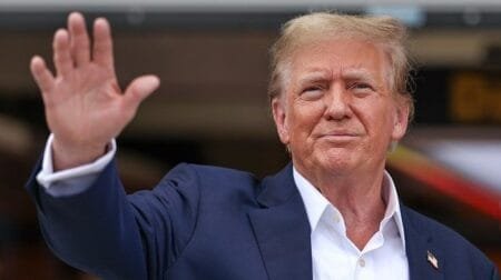 Former President Trump waves to fans during the F1 Miami Grand Prix on May 5, 2024. (Song Haiyuan/MB Media/Getty Images)