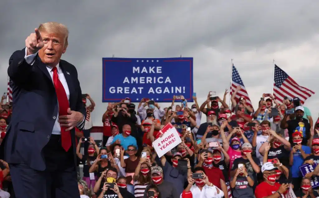 Some fans even donned Trump costumes and American flag-themed outfits for the rally (AP) Some fans even donned Trump costumes and American flag-themed outfits for the rally (AP)