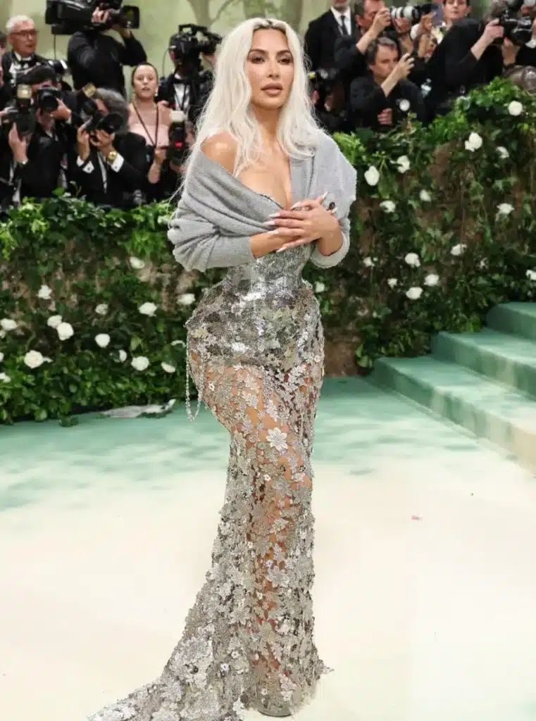 The star covered her Maison Margiela Artisanal look with a polarizing grey sweater. Getty Images The star covered her Maison Margiela Artisanal look with a polarizing grey sweater. Getty Images
