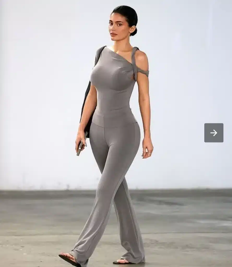 The Kardashians star wore a new Khy outfit consisting of flared pants and a matching top with a twisted shoulder design credit: BackGrid The Kardashians star wore a new Khy outfit consisting of flared pants and a matching top with a twisted shoulder design credit: BackGrid