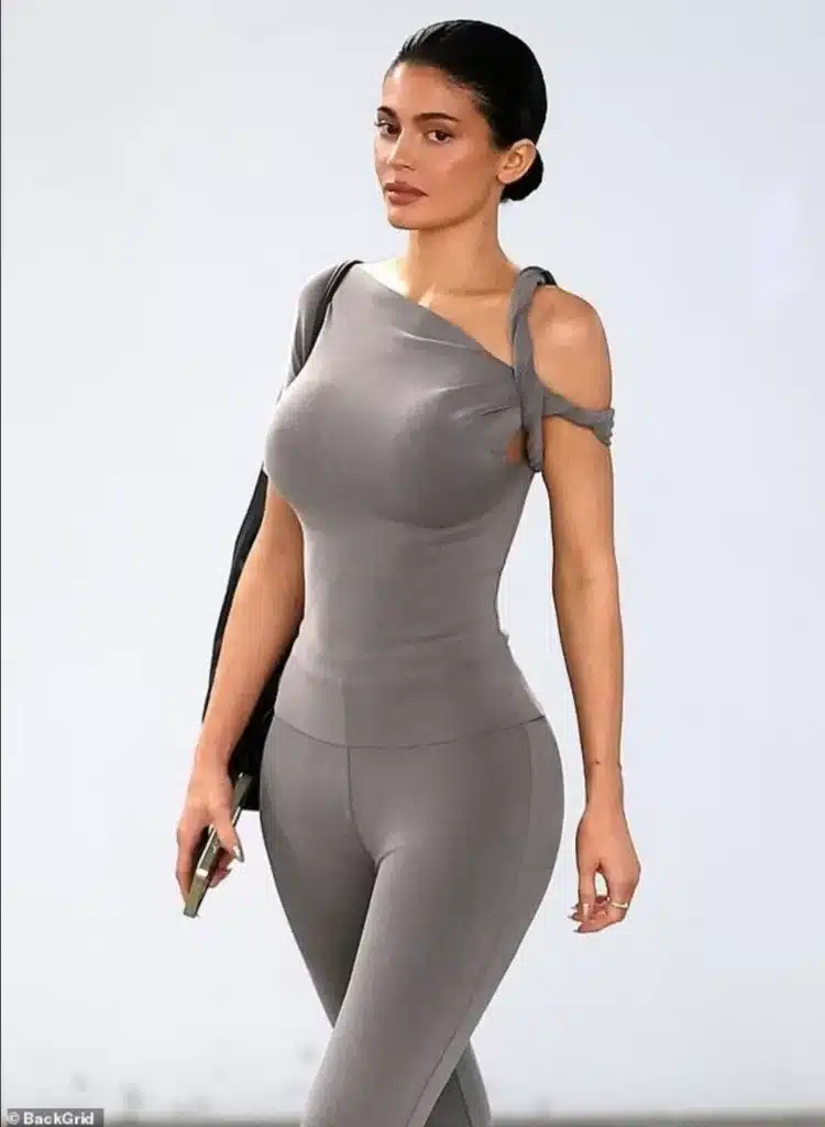 The Kardashians star wore a new Khy outfit consisting of flared pants and a matching top with a twisted shoulder design credit: BackGrid The Kardashians star wore a new Khy outfit consisting of flared pants and a matching top with a twisted shoulder design credit: BackGrid