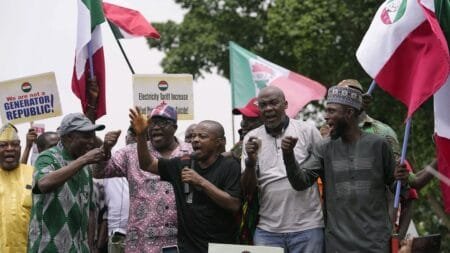 FILE - Joe Ajaero, centre, Nigerian Labor Congress President, speaks during a protest