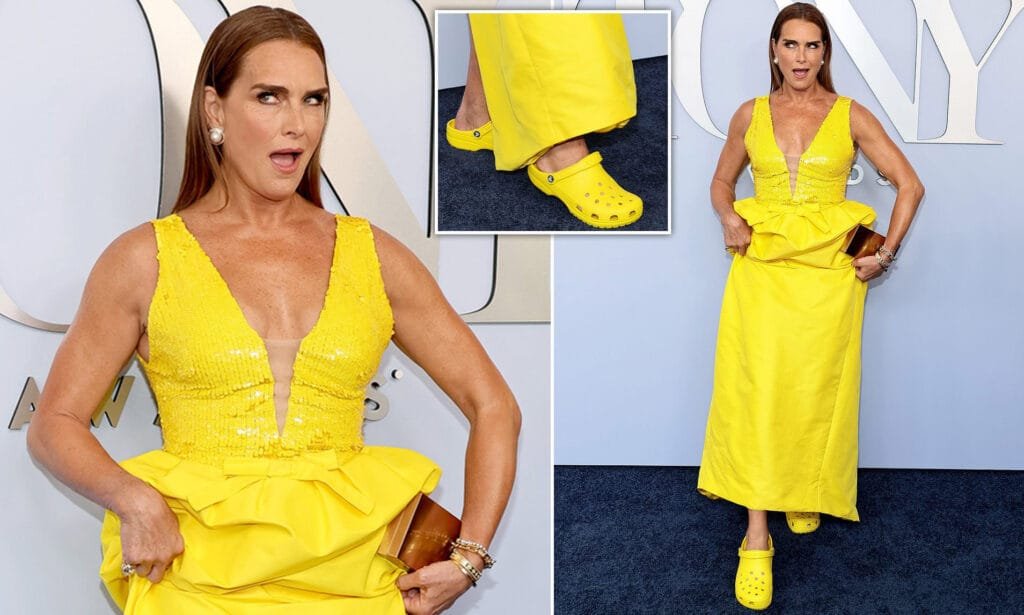 Brooke Shields paired her glamorous gown with bright yellow Crocs for the 77th Tony Awards in New York City © Provided by Daily Mai