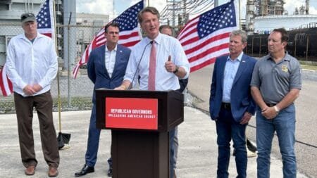 Louisiana Gov. Jeff Landry, speaking at the podium, is joined by, from left, Govs. Mike Dunleavy of Alaska, Chris Sununu of New Hampshire, Brian Kemp of Georgia, Kevin Stitt of Oklahoma, Glenn Youngkin of Virginia and Doug Burgum of North Dakota at a news conference at an oil refinery in Chalmette, Louisiana, on Monday.  (Fox News - Paul Steinhauser)