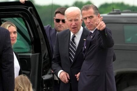 Hunter, 54, is photographed pointing before he and his father motorcade to the president’s nearby home in Wilmington, Del.AP