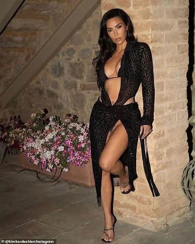 The mom-of-four completed the look with a pair of strappy heels and wore her raven tresses in bouncy locks The mom-of-four completed the look with a pair of strappy heels and wore her raven tresses in bouncy locks