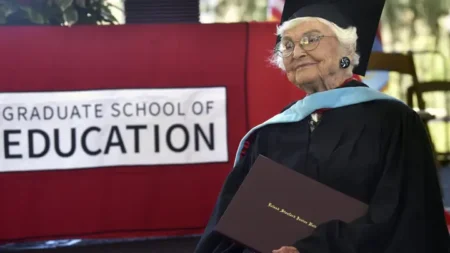 Virginia Hislop received her diploma during a graduation ceremony from Stanford University's Graduate School of Education last month. She began her Stanford journey as an undergraduate student in 1936. (Charles Russo for Stanford University