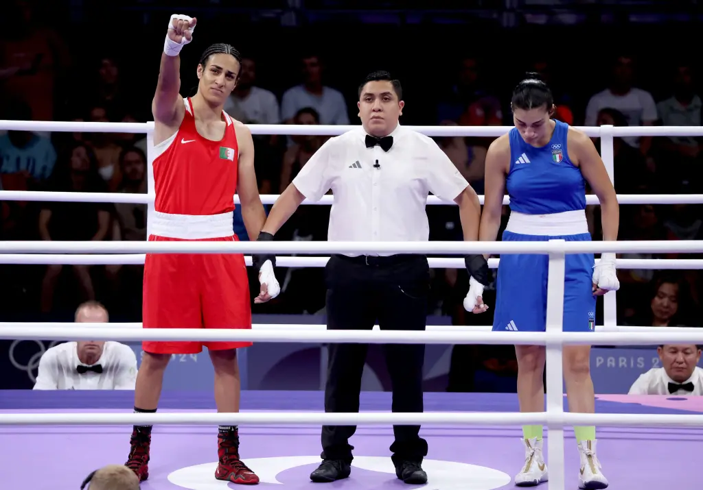 Algerias Imane Khelif l is declared the winner over Italys Angela Carini r in a womens welterweight boxing match at the Olympics on Aug 1 2024 - M10news