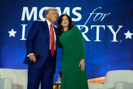 Republican presidential nominee former President Donald Trump stands with Moms for Liberty co founder Tiffany Justice during an event at the groups annual convention in Washington Friday Aug 30 2024