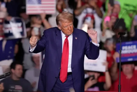 Donald Trump dances at a campaign event at the Ryder Center at Saginaw Valley State University in Michigan on Oct 3