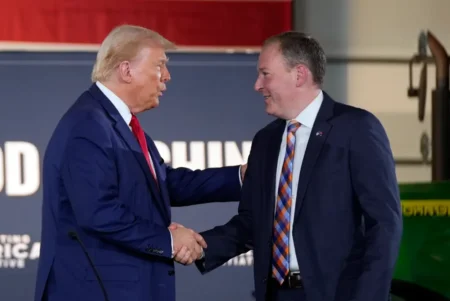 Donald Trump greets Lee Zeldin as he arrives to speak at a campaign event at a farm Monday Sept 23 2024 in Smithton Pa