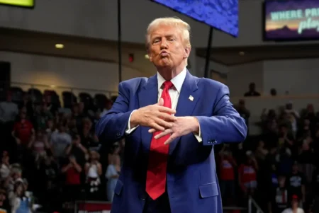 Former President Donald Trump blows a kiss at his rally in Arizona on Sunday