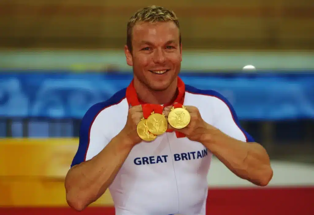 Hoy shows off his three medals he won at the 2008 Beijing Olympics