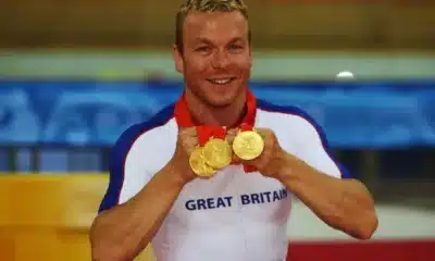 Hoy shows off his three medals he won at the 2008 Beijing Olympics