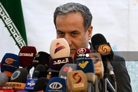 Iranian Foreign Minister Abbas Araghchi speaks to the press after meeting with Syrian officials at the Iranian embassy in Damascus on October 5, 2024. (Photo by LOUAI BESHARA / AFP)