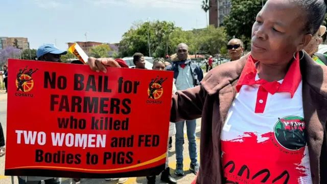 Protesters held up placards outside the courtroom in Polokwane demanding that bail be denied