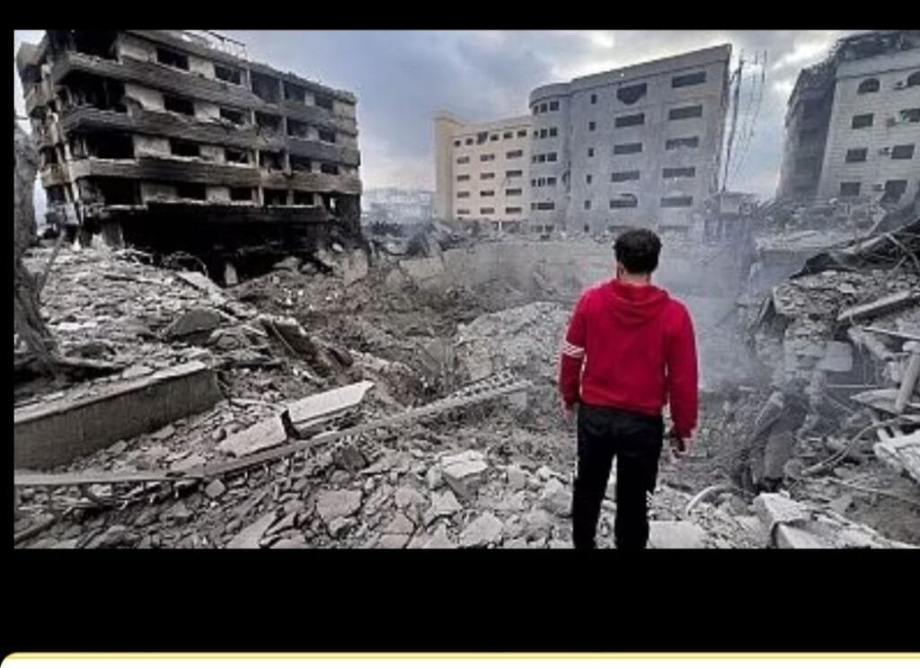 A man looks at destroyed buildings hit by Israeli airstrikes in Dahiyeh, Beirut, Lebanon, Monday, Oct. 7, 2024