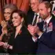 A bearded Prince William and Princess Kate were all smiles this evening as they clap as the performers take to the stage