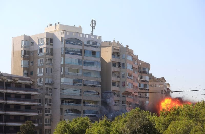 An Israeli strike destroys a building in the Tayouneh neighborhood in Beirut Lebanon on November 15 2024