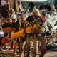 Members of Spains military clear debris from streets in the town of Benetusser Valencia on Saturday AFP