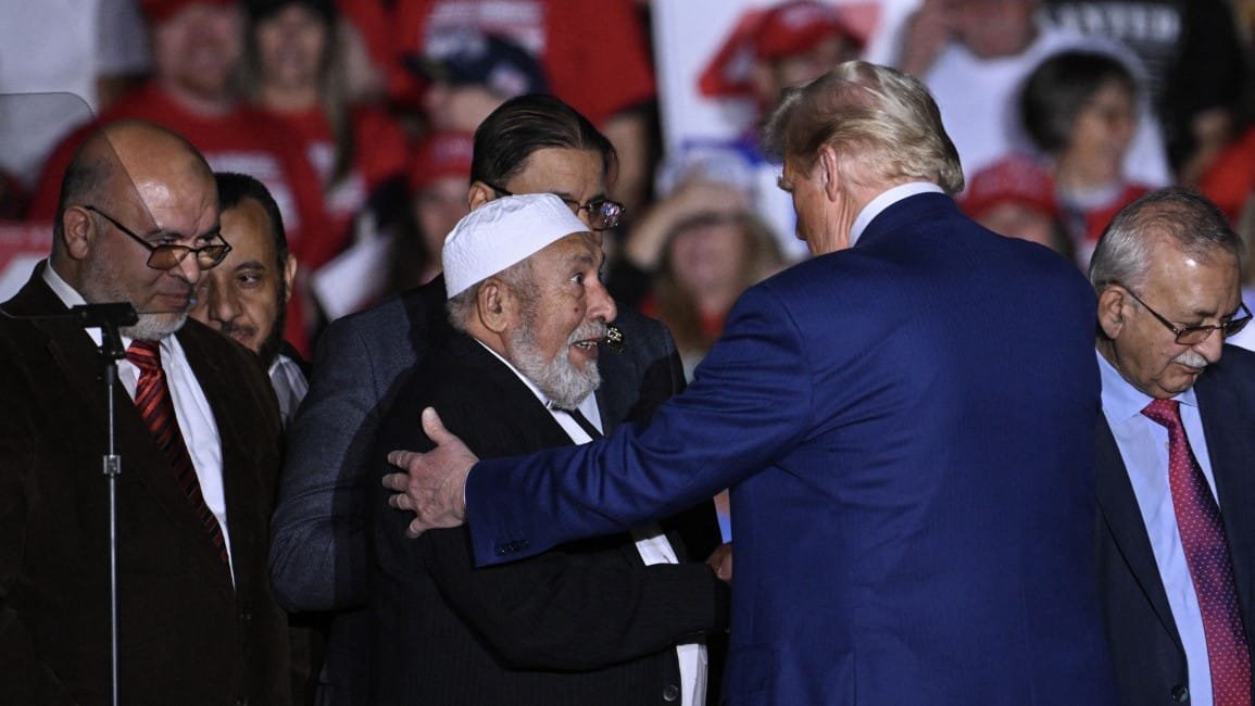 Republican candidate Donald Trump greets local leaders of the Muslim community who endorsedd him onstage during a campaign rally at the Suburban Collection Showplace in Novi Michigan October 26 2024 Getty