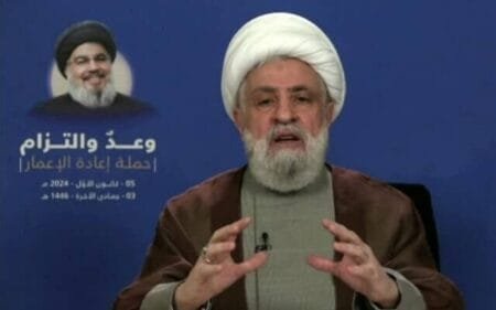 An image grab taken from Hezbollahs Al Manar TV on December 5 2024 shows Hezbollah chief Naim Qasem delivering a televised speech from an undisclosed location