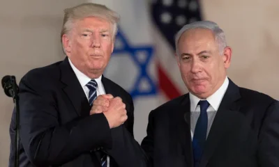 President Trump and Israeli Prime Minister Benjamin Netanyahu shake hands at the Israel Museum in Jerusalem. Trump has promised "hell to pay" if hostages being held by Hamas are not released prior to when he takes office on Jan. 20. (AP/Sebastian Scheiner)