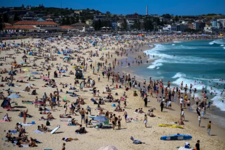 Thousands of people have flocked to celebrate Christmas Day at a Sydney beach party that has been hailed as a pretty special event despite reports of injuries and assault