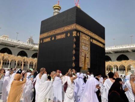 Pilgrims walk around the Kaaba, a sacred shrine in the center of the Grand Mosque in Mecca, Saudi Arabia, March 6, 2022. AMR NABIL / AP