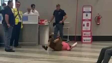 Meltdown at Milan Airport: Tourist Breaks Down Over Overweight Luggage Amid Surge in Passenger Chaos