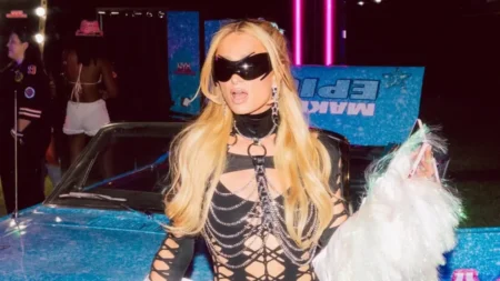 At Coachella 2025 Paris Hilton rocked a wild fishnet jumpsuit that revealed a lot of skin
