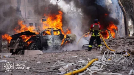 Firefighters work at the site of a Russian missile strike in central Sumy, Ukraine, on Sunday. State Emergency Service of Ukraine/Reuters