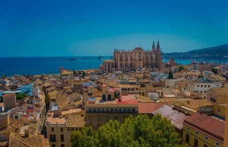 Stunning view of Palma's cathedral and city skyline, showcasing its rich history and architecture.