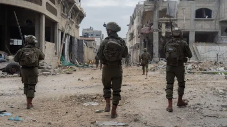Troops of the 401st Armored Brigade operate in Gaza City's Zeitoun, in a handout image published by the IDF on March 3, 2024. (Photo credit: Israel Defense Forces)