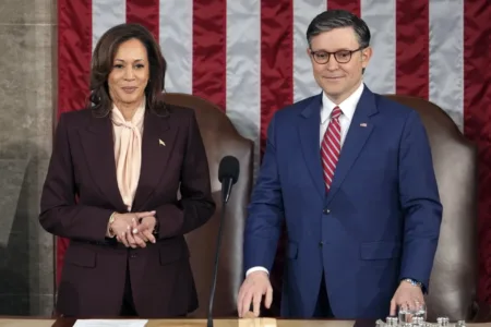 Vice President Kamala Harris stands with House Speaker Mike Johnson of La., as a joint session of Congress convenes to confirm the Electoral College votes, affirming President-elect Donald Trump’s victory in the presidential election, Monday, Jan. 6, 2025, at the U.S. Capitol in Washington. (AP Photo/Matt Rourke) Read More By  The Associated Press