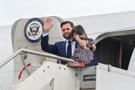 JD Vance disembarks Air Force Two (Kenny Holston/The New York Times via AP)
