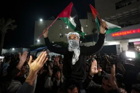 Palestinians celebrate the announcement of a ceasefire deal between Hamas and Israel in Deir al-Balah, central Gaza Strip (Picture AP)