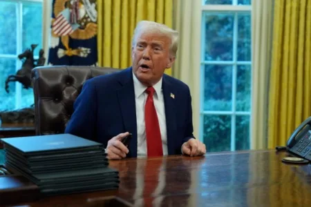 President Donald Trump speaks before signing an executive order in the Oval Office of the White House (Picture: AP)