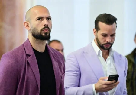 Andrew (left) and Tristan (right) reportedly boarded a private jet (Picture: AFP)