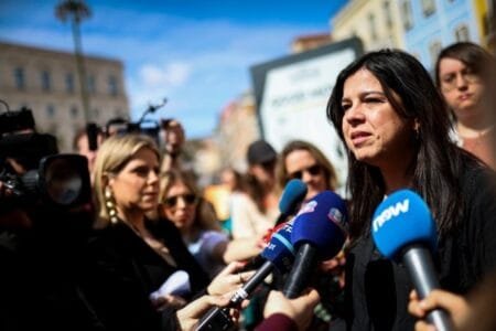 The spokesperson of People-Animals-Nature (PAN) party, Ines de Sousa Real (R), speaks to journalists during the protest ‘Rape is not filmed, it is condemned’ in front of Parliament (Picture: EPA)